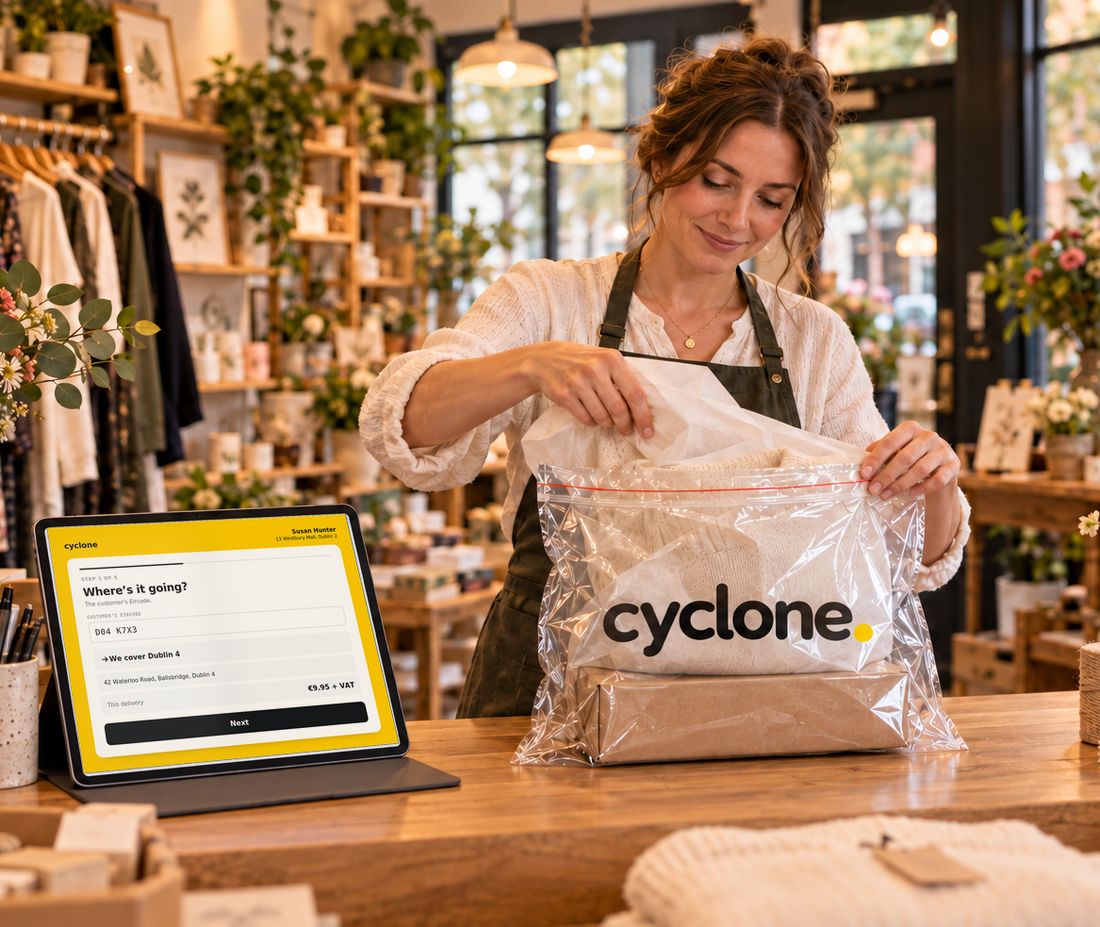 A shopkeeper packing an order into a Cyclone bag